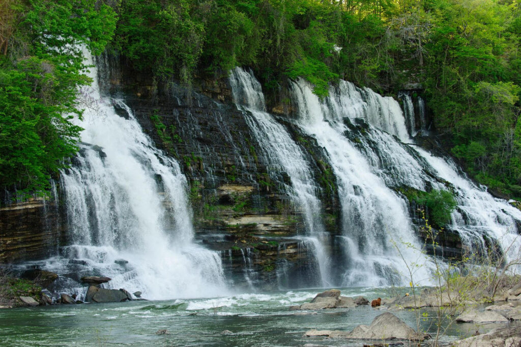 Twin Falls at Rock Island run into the river perpendicular to the flow of the river, one of the more unique of the best tennessee waterfalls